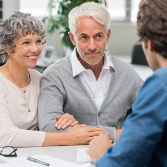 Senior couple meeting real estate agent. Senior couple meeting financial advisor for investment. Happy mature man and woman listening to various investment plans for their retirement.